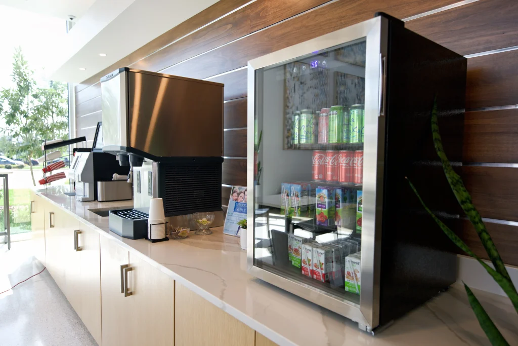Complimentary coffee and cold drink bar for patients at Pearl Dental Group