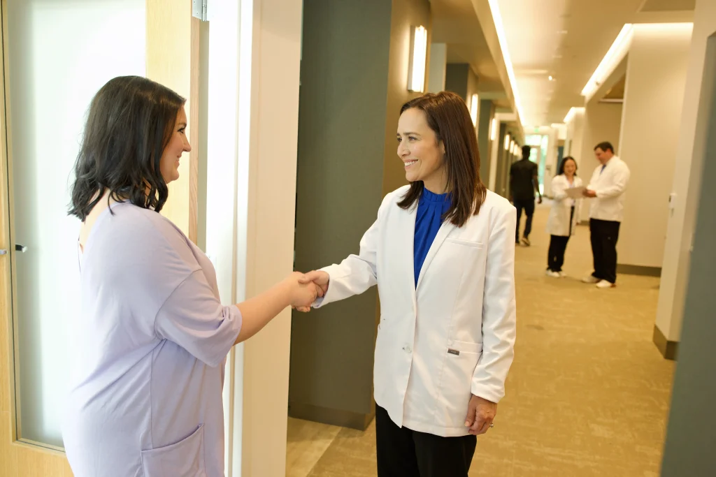 Dr. Jessica Bruni welcoming a patient at Pearl Dental Group in Baton Rouge